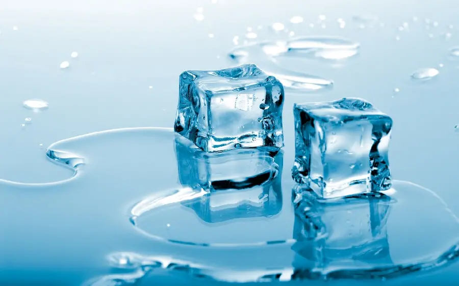 Interesting wallpaper of two pieces of cubic ice crystals next to beautiful water droplets