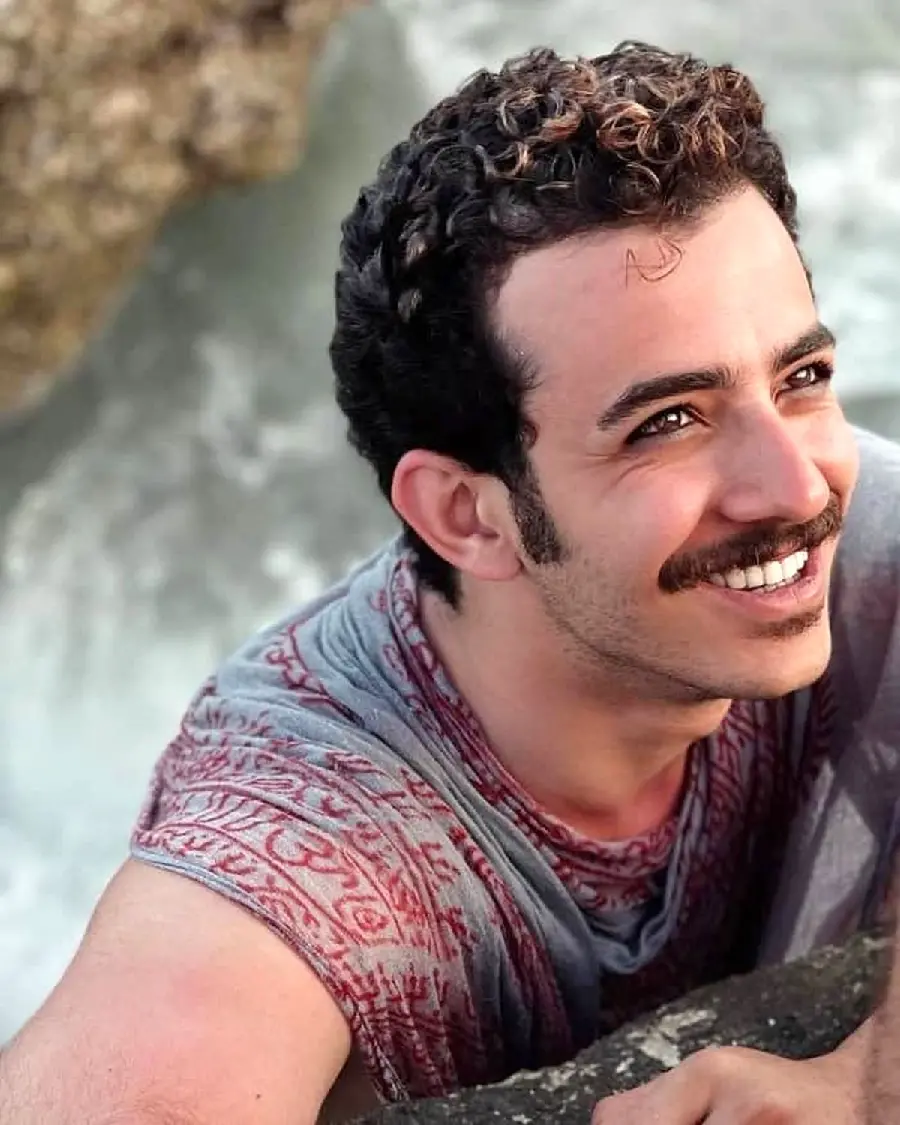 Picture of Ali Shadman smiling, suitable for laptop background