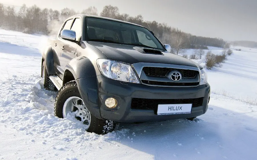 Stylish black Toyota Hilux profile photo in the snow