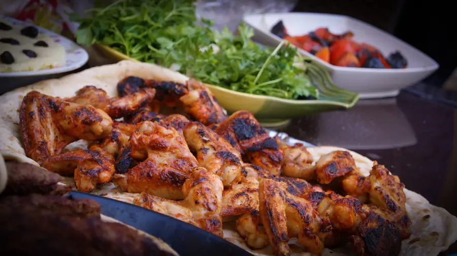 Download the most viewed stock photo of a traditional chicken kebab with bread and tomatoes and special WhatsApp vegetables
