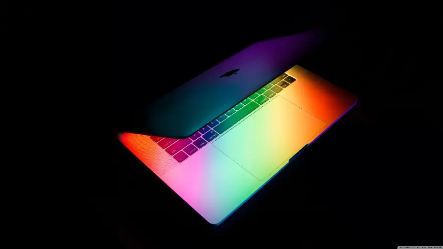 Download colorful background image of Apple laptop and the bitten apple logo engraved on it with pure quality