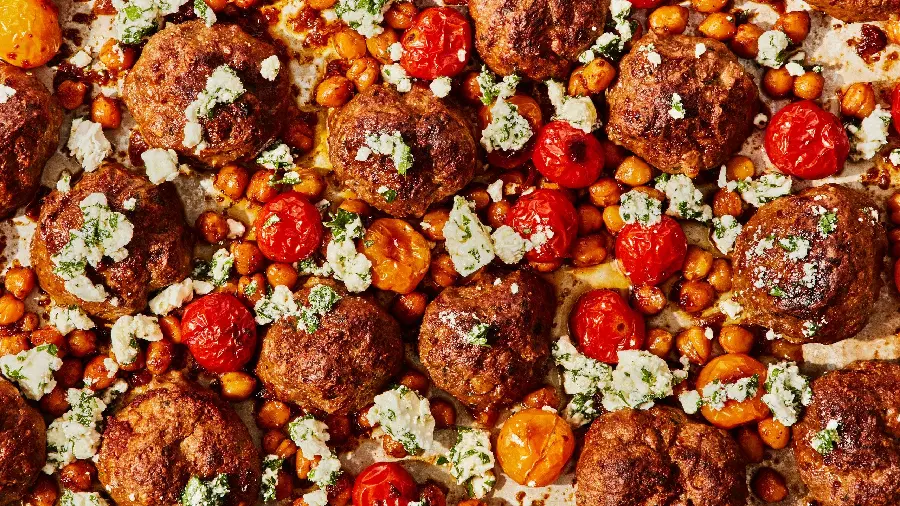 Download the most beautiful high-quality wallpaper of the most eye-catching food, meatballs with oven-baked tomatoes and Bukhara plums, decorated with cheese and small vegetables