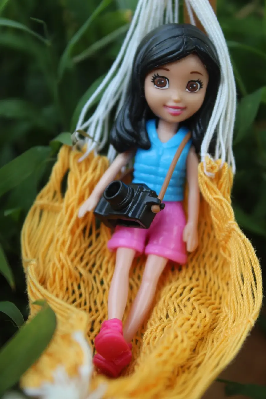 Interesting phone background with a toy design of a photographer girl