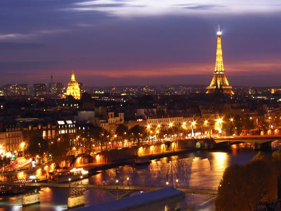 A mysterious and luminous image of the buildings and landscapes of the city of Paris, the symbol of French culture, at night