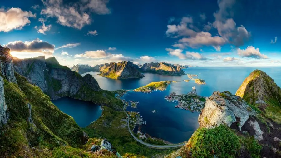 A spectacular image of the young nature of the ocean and mountains and blue sky in excellent quality suitable for Apple phones