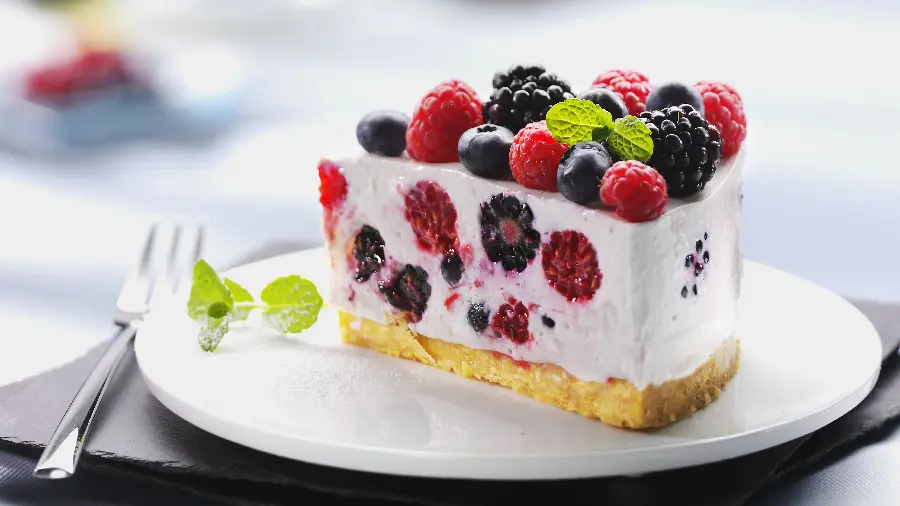 Download lovely background and background of strawberry and raspberry cheesecake on a white plate for dessert lovers