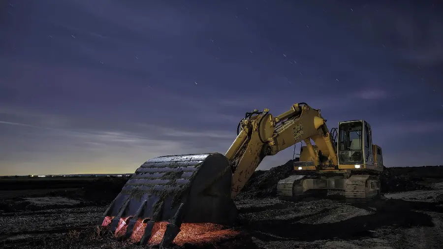 Masterpiece image of a huge excavator in the dark of night