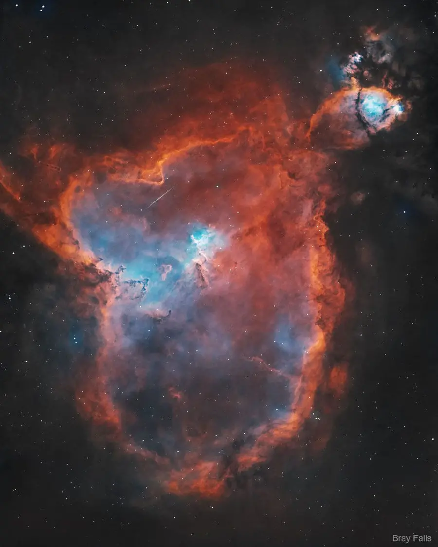 Popular computer background of orange and blue heart nebula in high quality