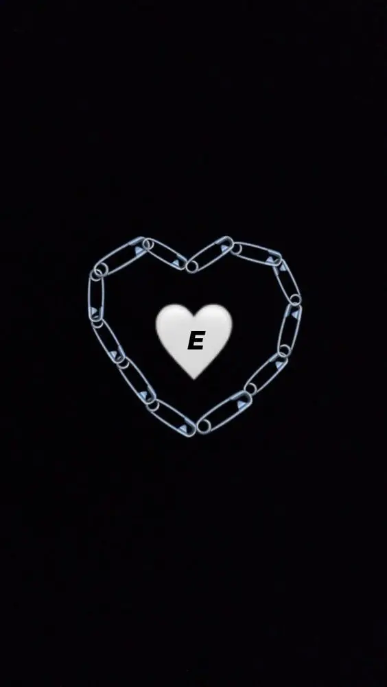 Love story photo of the letter E with a white heart emoji and a pin 