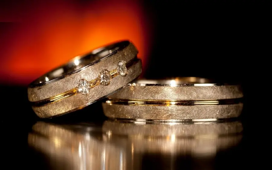 The most popular background of two wide golden bangles with exceptional patterns and designs