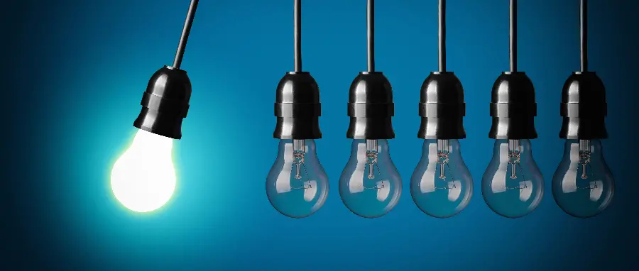 Interesting photo of a domino effect of a light bulb hitting an unlit light bulb