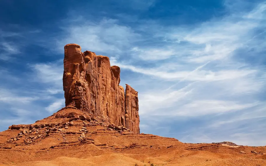 High quality background photo of a lonely rock with a cloudy blue sky for WhatsApp