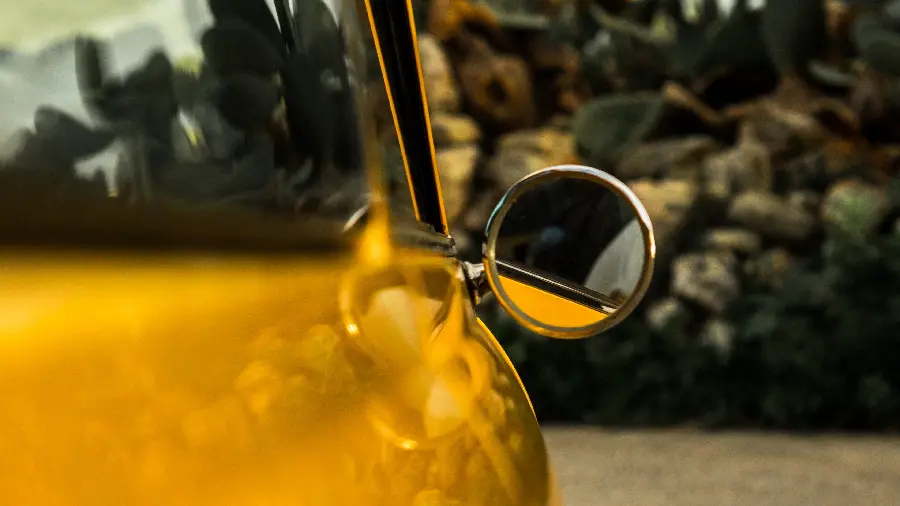 Beautiful background and background image with high quality of the side mirror of a yellow car