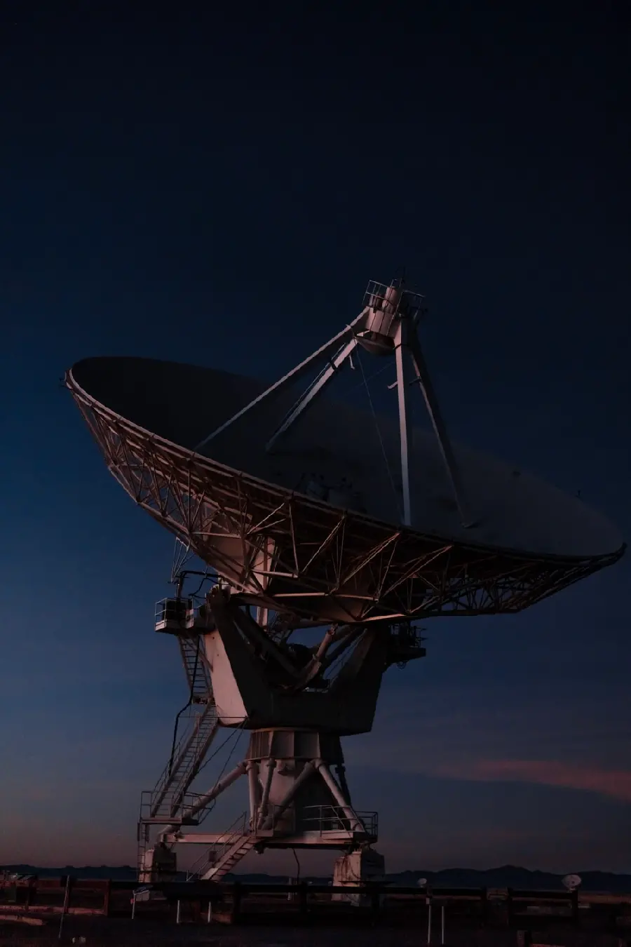 The highest quality artistic view of a satellite dish in the dark night 