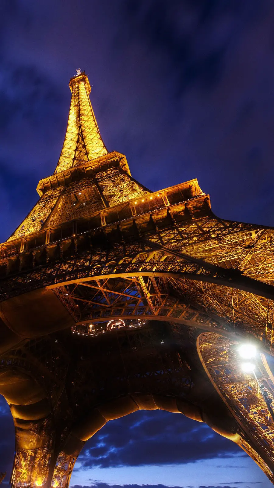 Download a giant poster of the great structure of the Eiffel Tower, the city of Paris, the symbol of French culture, in the darkness of the night