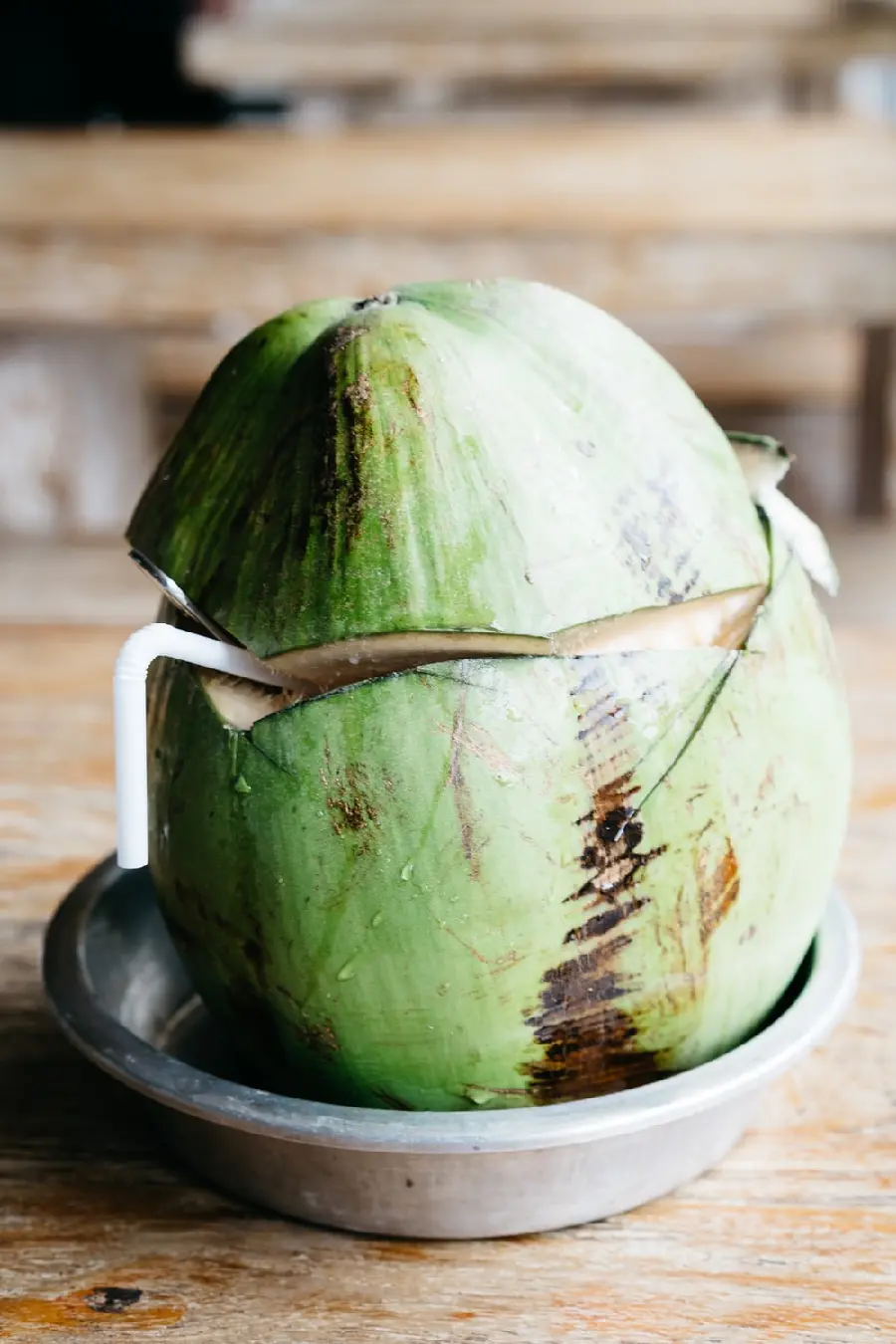 A very high-quality photo of a green coconut drink with a suitable size for a mobile background