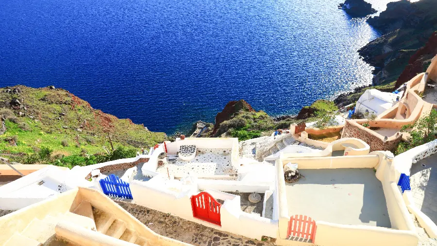 Top quality wallpaper of beautiful pink, red and blue doors of Santorini