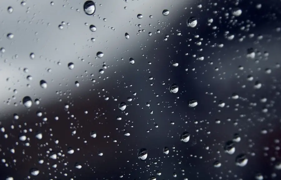 New photo of a rain-splattered glass for a profile