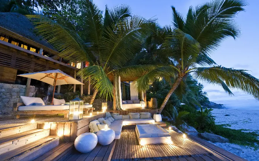 A romantic and fully furnished vector of a beach house, the same villa, with sunbeds and green trees