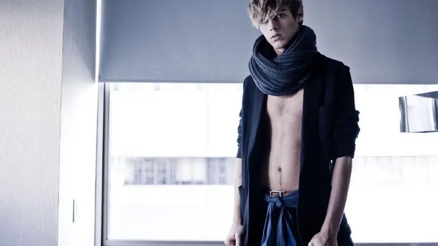 The most unusual modeling image with a man in an unbuttoned shirt and a scarf