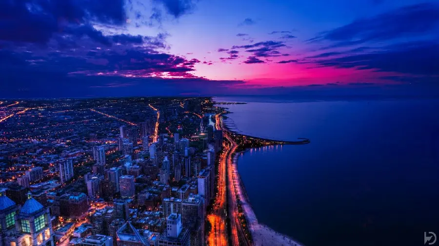 Cool stock image of a big, bright city view near the sea