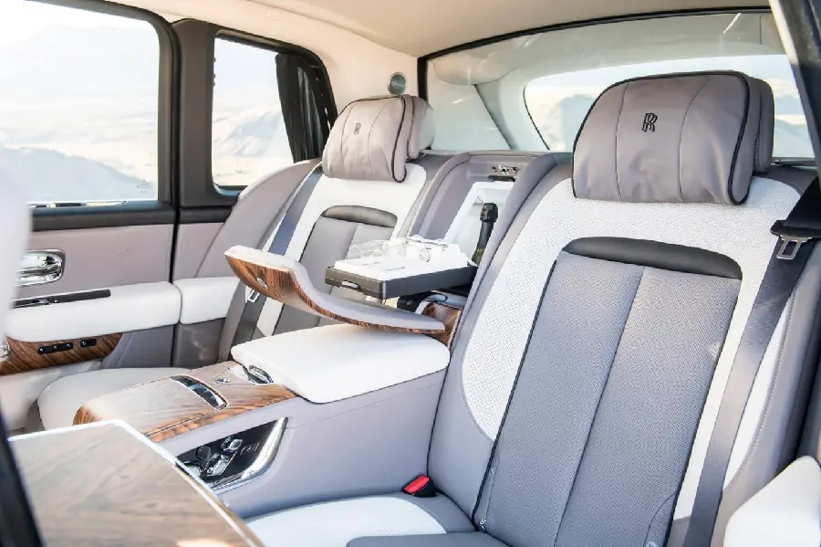 High quality background with the colors of 2 gray and white seats inside the Rolls Royce