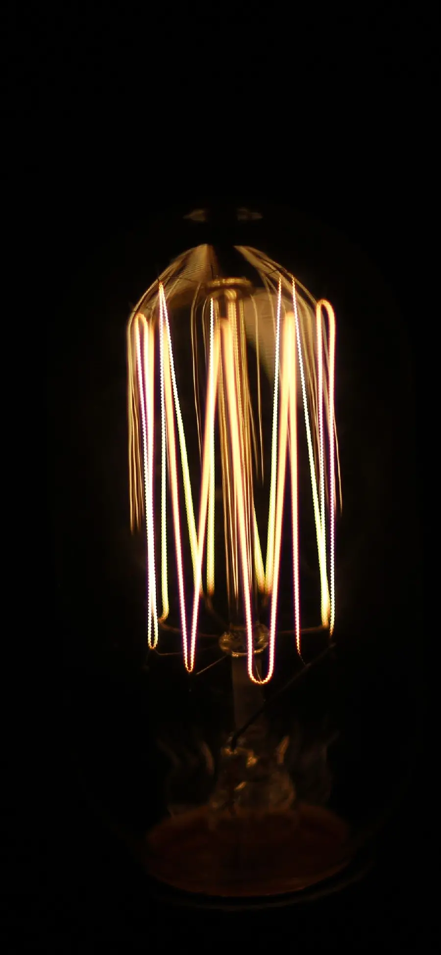 A very interesting photo of a bright lamp with a strange and spectacular design