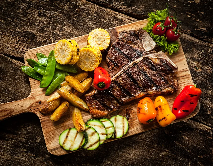 Photo of Different Types of Steaks with Different Vegetables