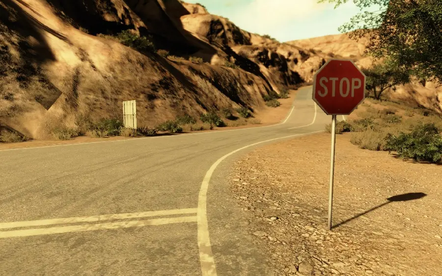 Stock photo of a stop sign on the side of the street with an old effect