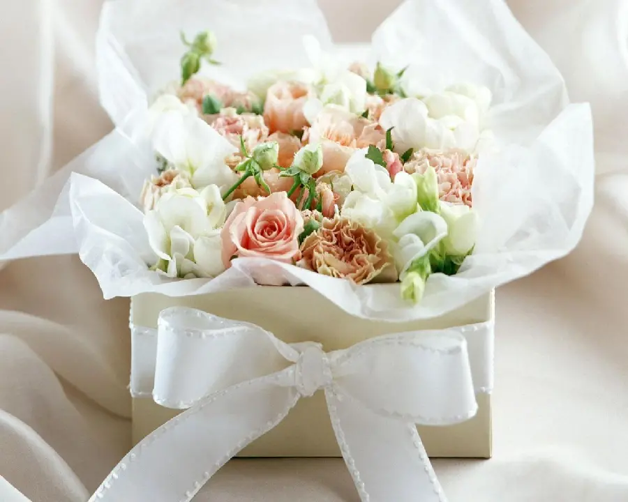Stylish Stock Image of a Box of White Roses and Other Colored Flowers with a Special White Ribbon for a Gift