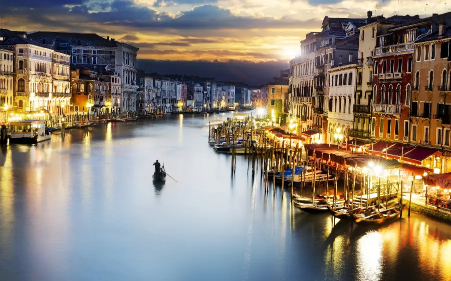 Download a dreamy and cute photo of a blue city with beautiful and new buildings and a boat in the middle