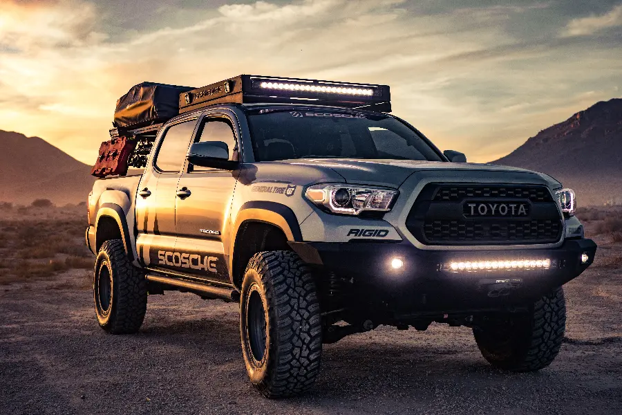 Cloud and wind background photo of the beautiful Toyota Tacoma in low light