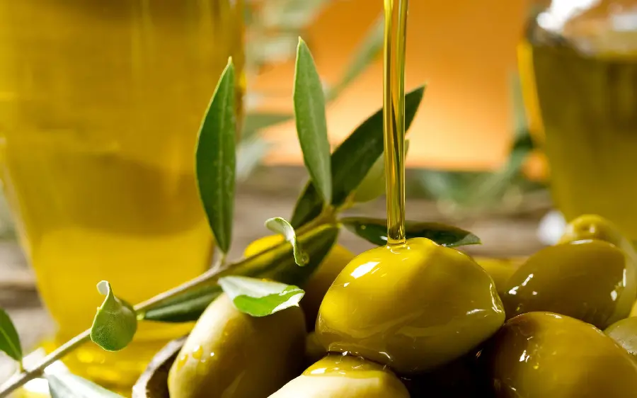 Delicious and beautiful olives photo with olive oil background in HD quality 