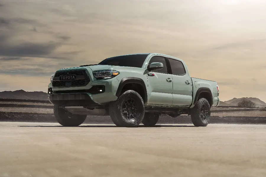 Glazed background of the huge Toyota Tacoma in the desert and the desert