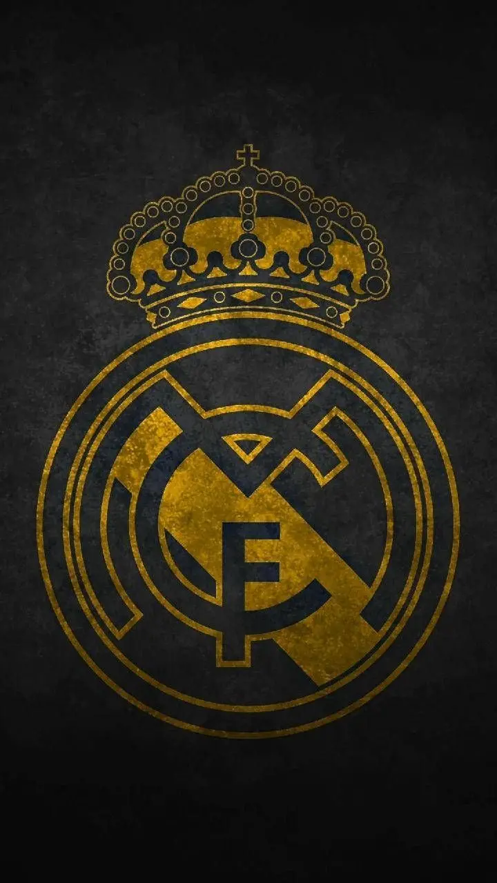 Download a luxurious stock photo of the Real Madrid golden logo on a dark background