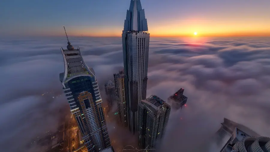 Download a unique photo for the background of the skyscrapers Through the clouds in hd quality