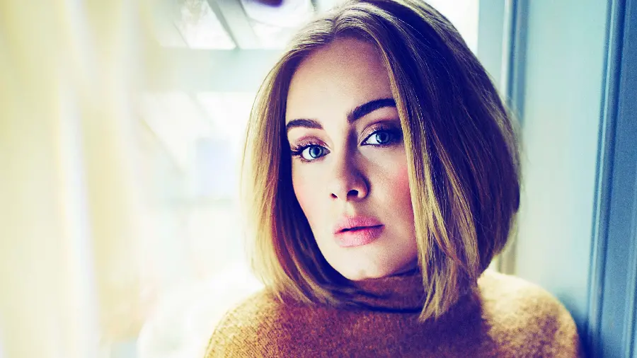 Download a background with high quality and superior to the face of the famous and beautiful British singer Adele