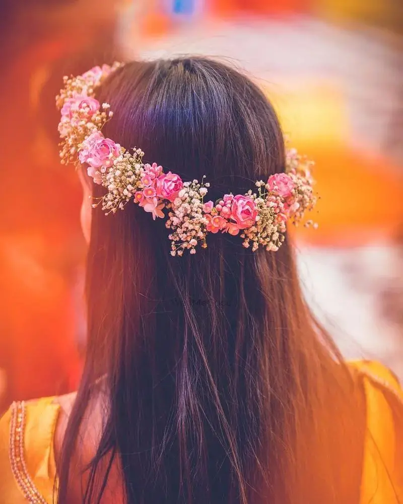 Beautiful profile picture of a long-haired girl with a pink flower crown 