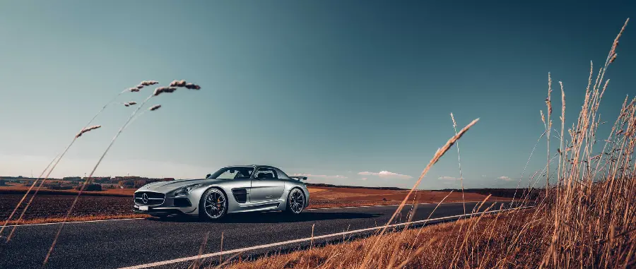 Download a shiny background image of a gray Mercedes-Benz next to a wheat field