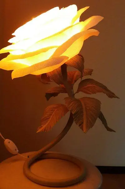 Attractive poster of a golden flower night light lit with large leaves