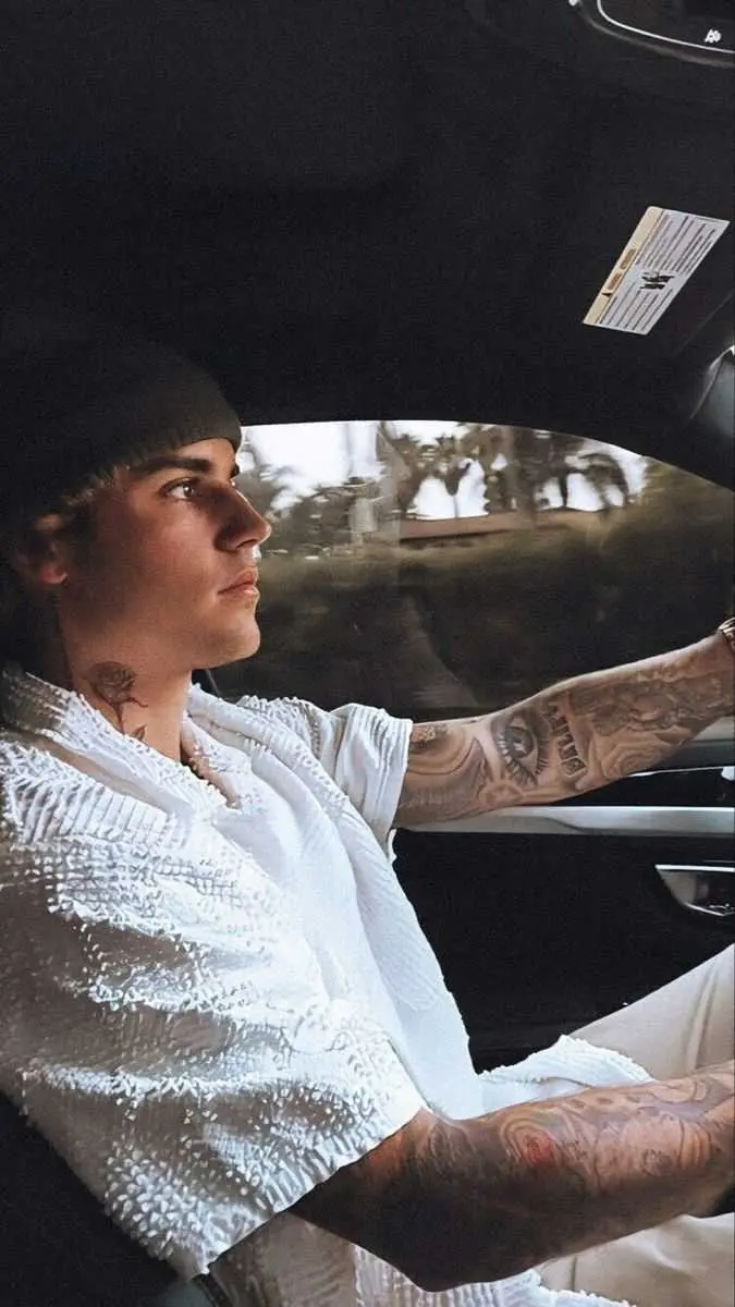 Luxury photo of Canadian singer Justin Bieber driving 