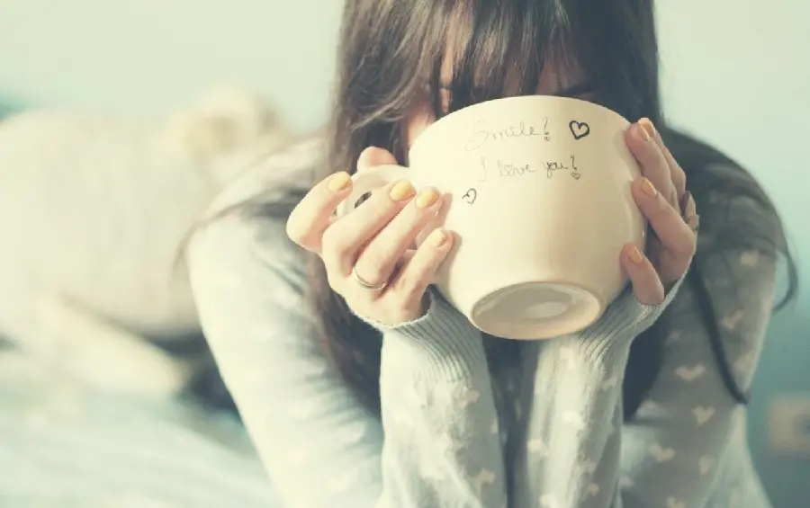 Cute profile photo of a girl drinking from a large glass