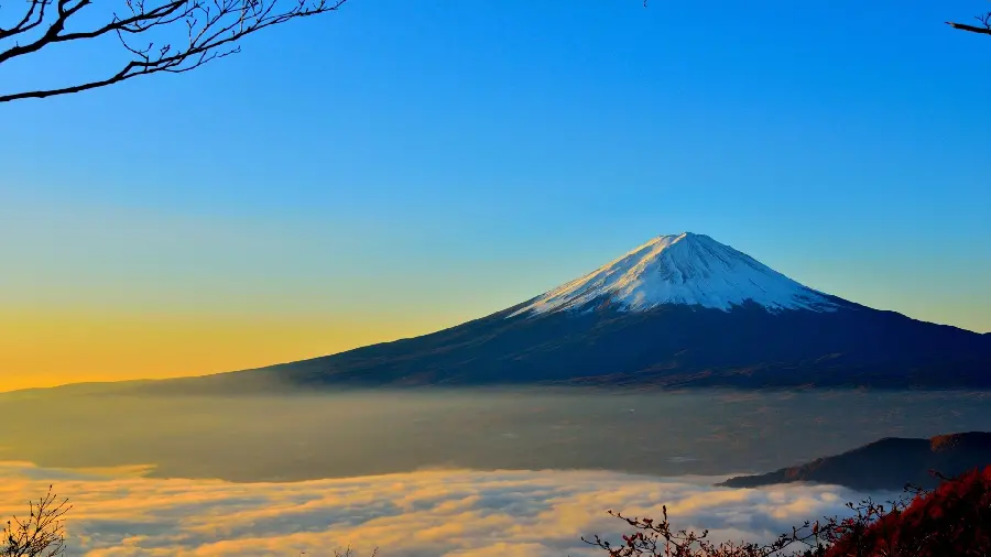 Masterpiece background of snowy mountain peaks among pleasant white clouds