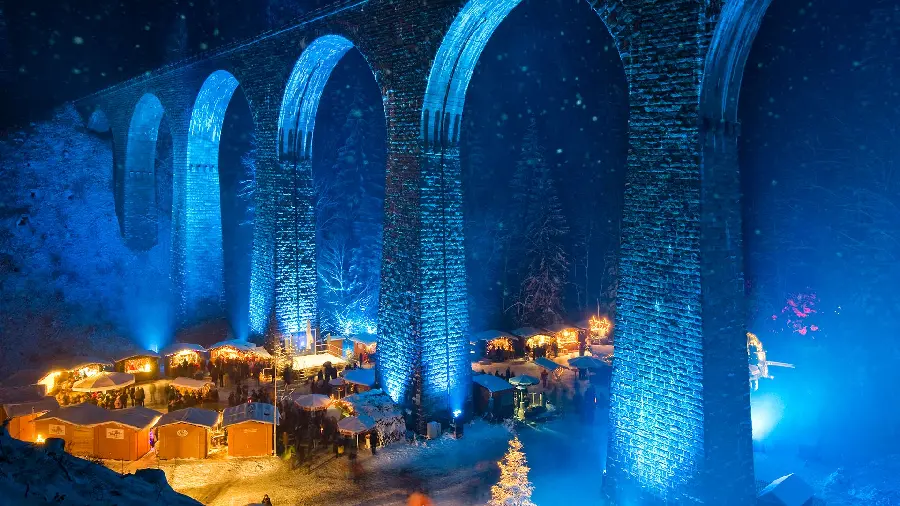 Popular background photo of a large bridge with blue lights in nature and a photo of a busy landscape and its bottom view