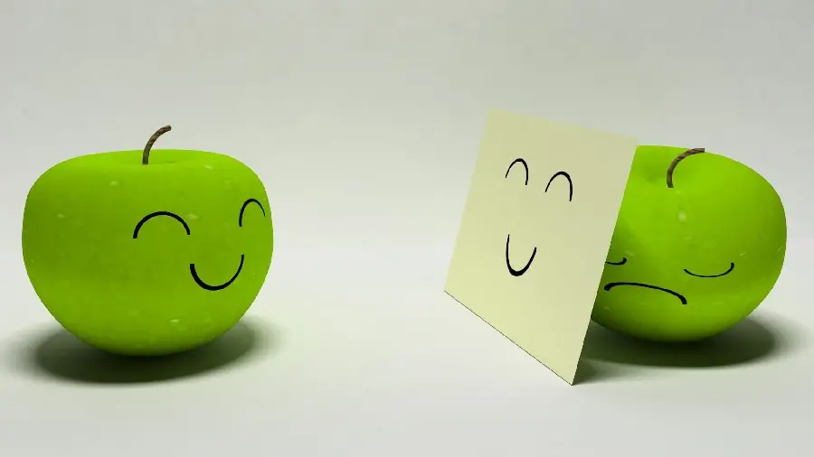 Fantasy photo of funny and sad green apple for profile 
