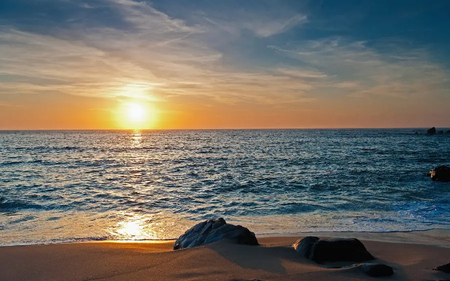 Magical background image of the sandy beach nature and the picture of the turbulent sea landscape in high quality