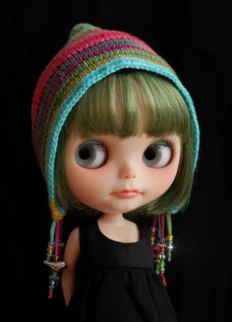 Green haired girl doll with cute look as desktop background 
