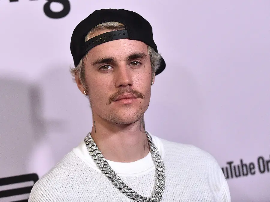 Attractive and handsome profile photo of Justin Bieber with a mustache in a high-quality frame