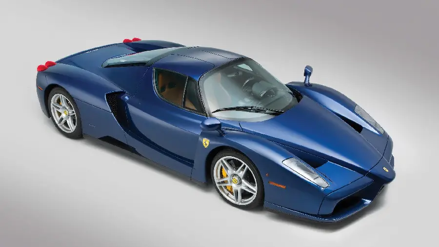 A very beautiful popular vector of a navy blue Ferrari Enzo on a white background