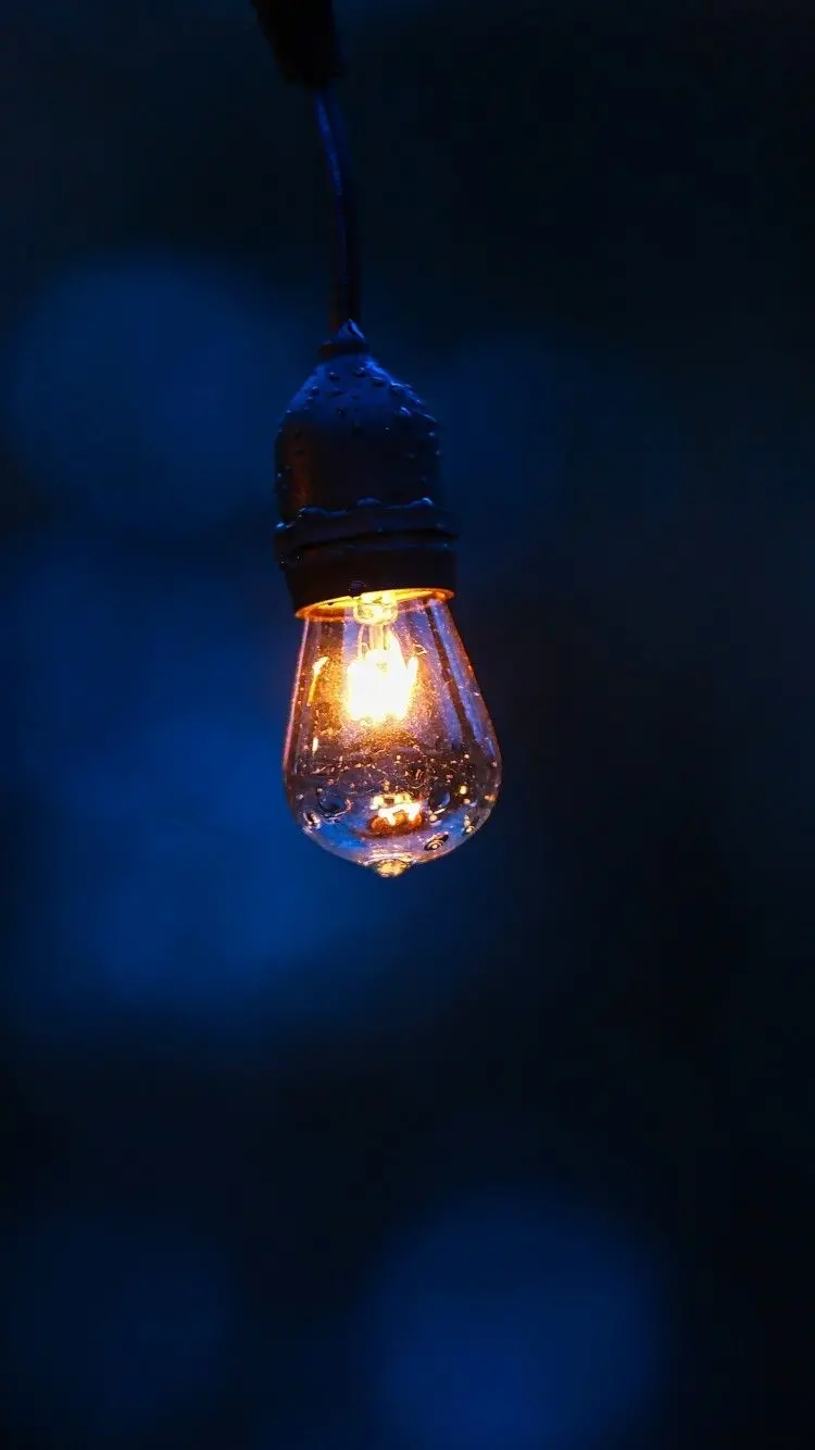 A dreamy artistic image of a lighted lamp for making a photo caption